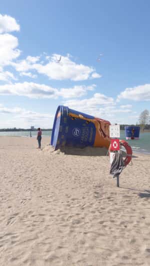 Giant Ice Cream Tub on Beach in a fake-out-of-home ad of Fazer