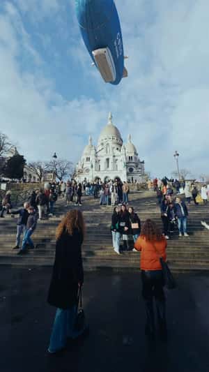 Giant Denim Airship Flies Above Paris in a fake-out-of-home ad of Celio