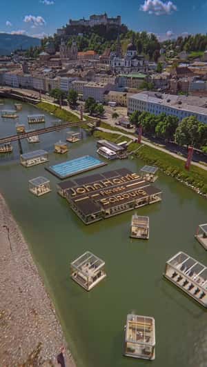Cubes Float on Salzburg River in a fake-out-of-home ad of John Harris Fitness