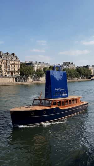 Giant Shopping Bag Rides Luxury Boat in a fake-out-of-home ad of Lefties
