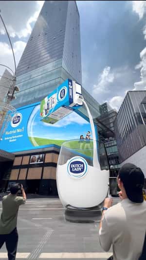 Milk Pours Into Giant Glass in a fake-out-of-home ad of Dutch Lady