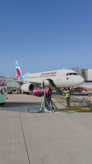 Giant Candies Load Into Airplane in a fake-out-of-home ad of Eurowings