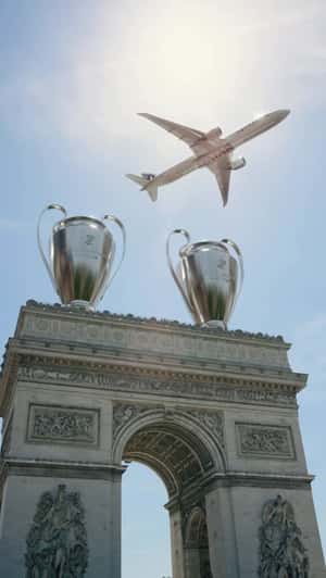Giant Trophies Above Arc de Triomphe in a fake-out-of-home ad of Paris Saint-Germain