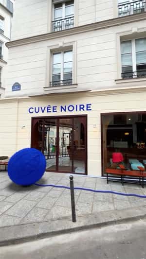 Giant Yarn Ball Unrolls Through Street in a fake-out-of-home ad of Cuvée Noire