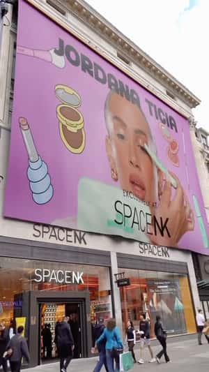 Giant Banner Unrolls on Facade in a fake-out-of-home ad of Jordana Ticia