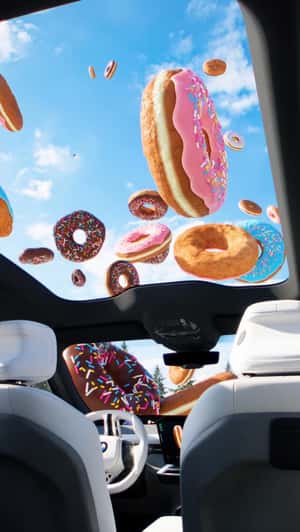 Giant Donuts Fall From the Sky in a fake-out-of-home ad of BMW