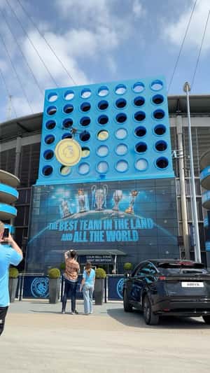 Giant Connect 4 Board fake out of home ad of Manchester City