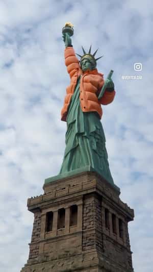 Statue of Liberty Wears Orange Jacket in Fake-out-of-home ad of Grubhub