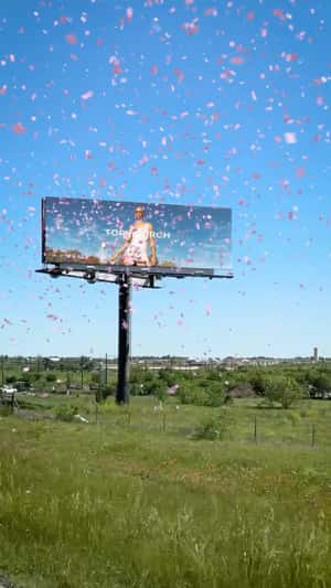 Post Billboard with Confetti in fake-out-of-home ad of Tory Burch