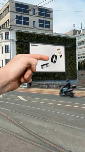 Billboard Ring Fits Finger in a fake-out-of-home ad of Samsung