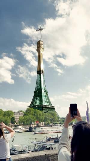Corking Eiffel Tower Bottle in Paris in a fake-out-of-home ad of Moët Hennessy