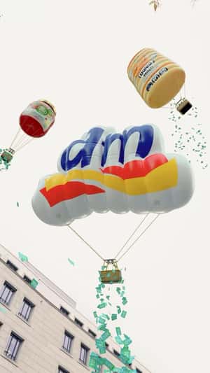 Inflatable Parachutes Drop Coupons in a fake-out-of-home ad of DM