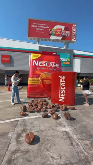 Pack and Mug Lands from Billboard in a fake-out-of-home ad of Nescafé