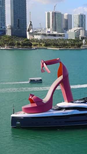 Pink Sandal Rides a Yacht background in fake-out-of-home ad of Alexandre Birman