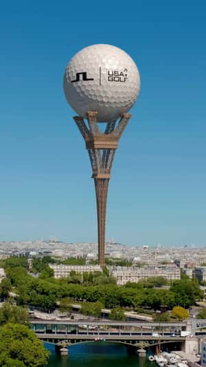 Golf Ball on Upside-Down Eiffel Tower in a fake-out-of-home ad of J.Lindeberg