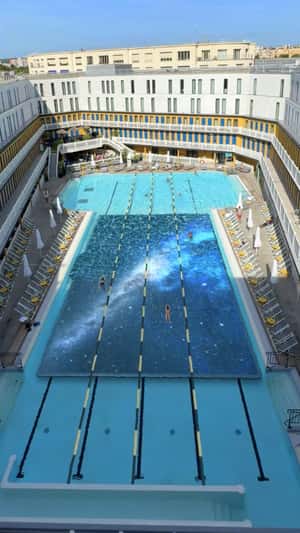 OLED TV Submerged in Olympic Pool in fake-out-of-home ad of LG