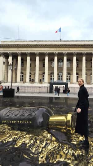 Perfume Floats on Black Gold Surface in fake-out-of-home ad of BOSS