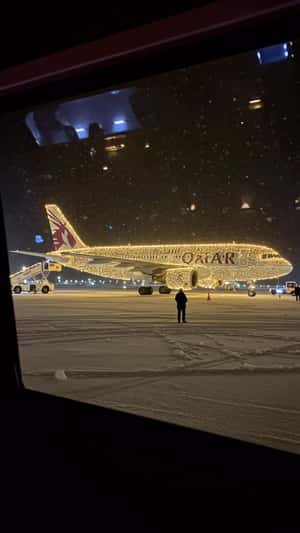 Plane Adorned with Lights in fake-out-of-home ad of Qatar Airways