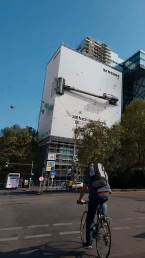 AI Vacuum on Billboard Sweeping in fake-out-of-home ad of Samsung