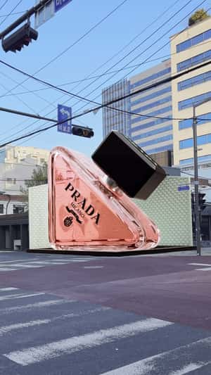 Perfume Bottle Descending on Street in a fake-out-of-home ad of Prada