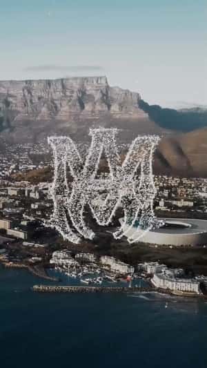 Logo Formed by Doves Midair in a fake-out-of-home ad of AMIRI
