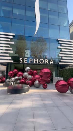 Christmas Balls Rolling in a fake-out-of-home ad of Sephora