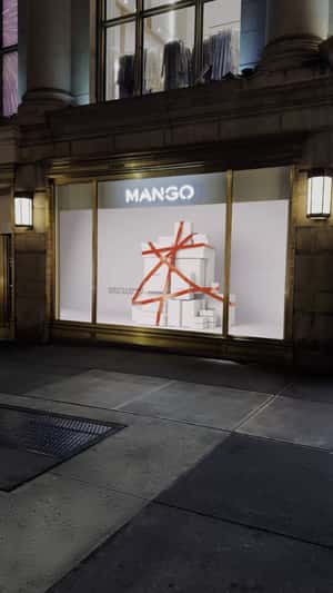 White Gift Boxes Filled with Red Balls in a fake-out-of-home ad of Mango