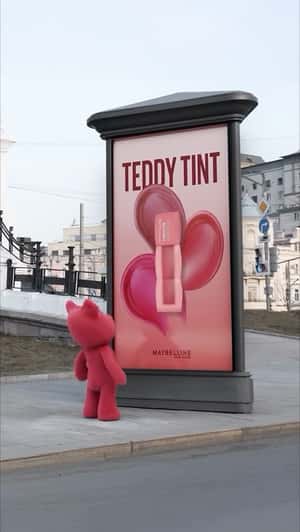 Pink Teddy Grabs Tint in a fake-out-of-home ad of Maybelline