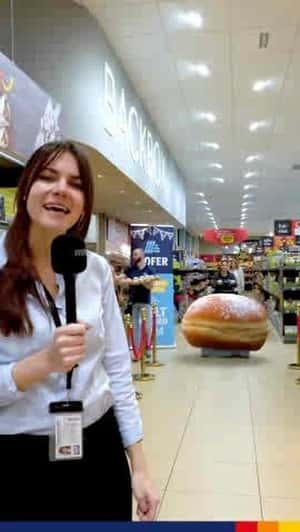 Krapfen Pastry on Trolley in a fake-out-of-home ad of Hofer