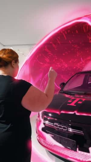Black Car Covered with Pink Bubble in a fake-out-of-home ad of Magenta Telekom