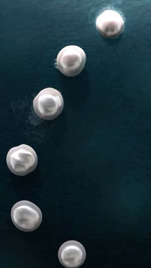 Floating Pearls in Waters in fake-out-of-home ad of Pandora
