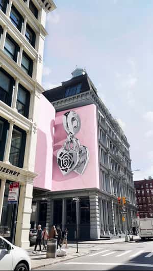 Rose Heart Charm on Hanging Book in fake-out-of-home ad of Pandora