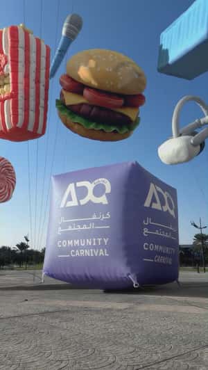 Colorful Inflatables Floats at Park in a fake-out-of-home ad of ADQ Community