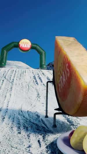 Ski Stunt on Melted Cheese Track in fake-out-of-home ad of Grand Frais