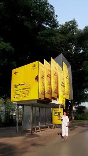 Drinkable Sunscreen Unpacks at Bus Shelter in fake-out-of-home ad of Setu