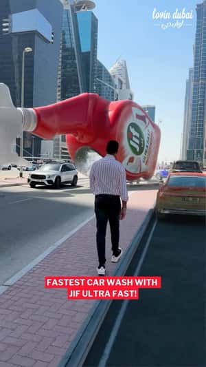 Cleaner Spray Cleans Car in the city in fake-out-of-home ad of Jif