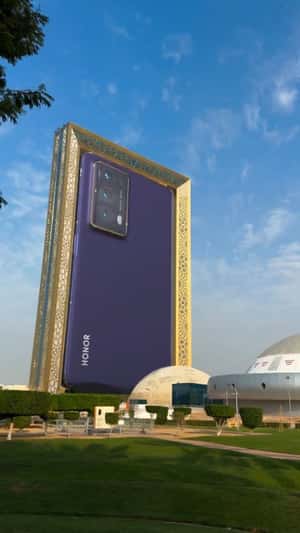 Flip Phone Unfolds in Dubai Frame in fake-out-of-home ad of Honor