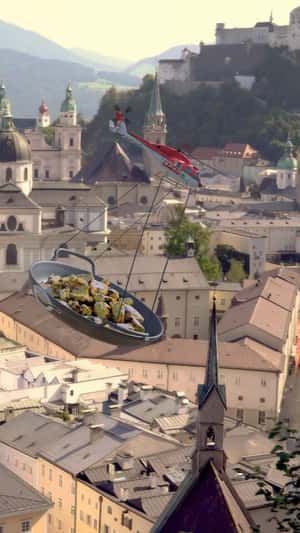 Helicopter Delivers Dessert on Pan in fake-out-of-home ad of Spar