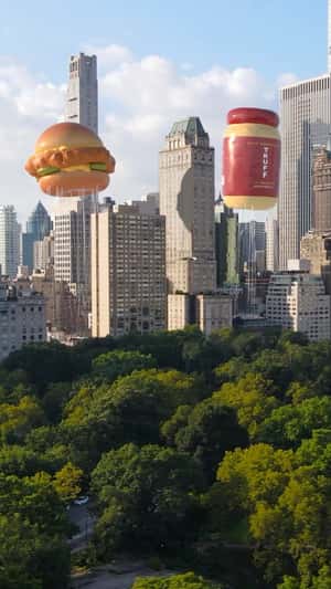 Popeyes and Truff parade balloons in fake-out-of-home ad of TRUFF