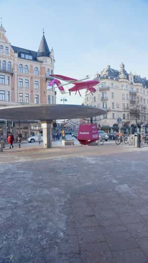 Pink Drone Plane Drops Burger in fake-out-of-home ad of Foodora