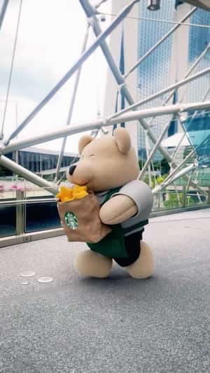 Teddy Bear with Bag Full of Stars in fake-out-of-home ad of Starbucks