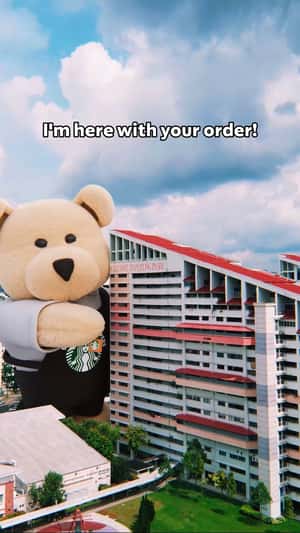 Teddy Bear Delivers at a Residential Area in fake-out-of-home ad of Starbucks