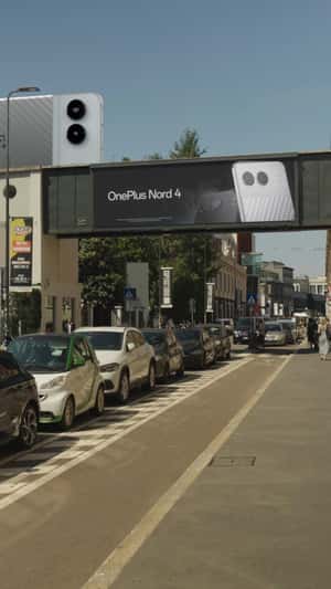 Phone Cruises the Street Like a Tram in fake-out-of-home ad of OnePlus