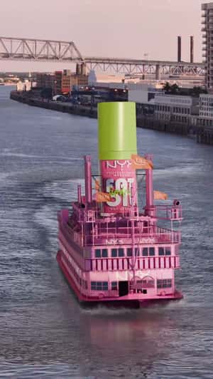 Lip Gloss Rides On Pink Ferry in fake-out-of-home ad of NYX Professional Makeup