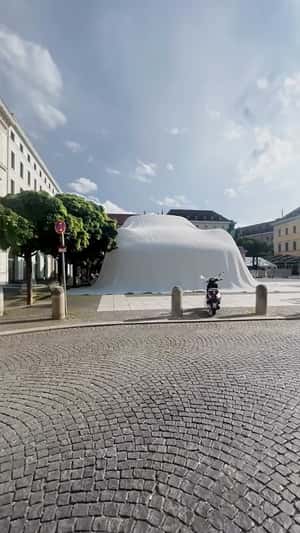 Gigantic Porsche covered at Wittelsbacherplatz in Munich fake-out-of-home ad of Porsche 