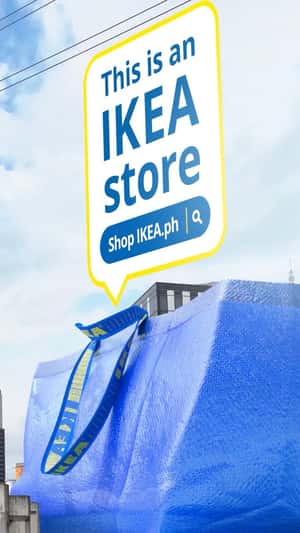 Blue Shopping Bag Towering Beside LRT in a fake-out-of-home ad of IKEA