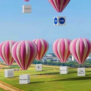 Parachute with Branded Boxes Descend in a fake-out-of-home ad of Nykaa