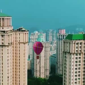 Pink Parachutes Carrying Signage in a fake-out-of-home ad of Nykaa