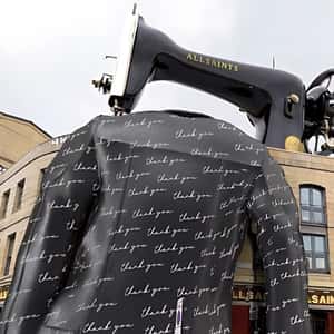 Sewing Machine Stitches Leather Jacket in a fake-out-of-home ad of AllSaints