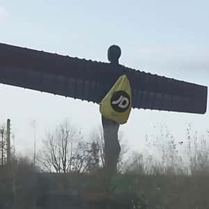 Duffle Bag on Worn by Statue in a fake-out-of-home ad of JD Sports